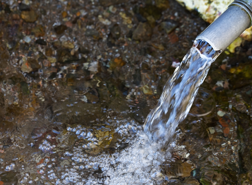 Fresh,Water,Emerging,From,A,Pipe.,Image,Illustrating,Water,Scarcity
